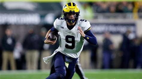 McCarthy throws 3 TD passes in 1st half, No. 2 Michigan routs Michigan State 49-0